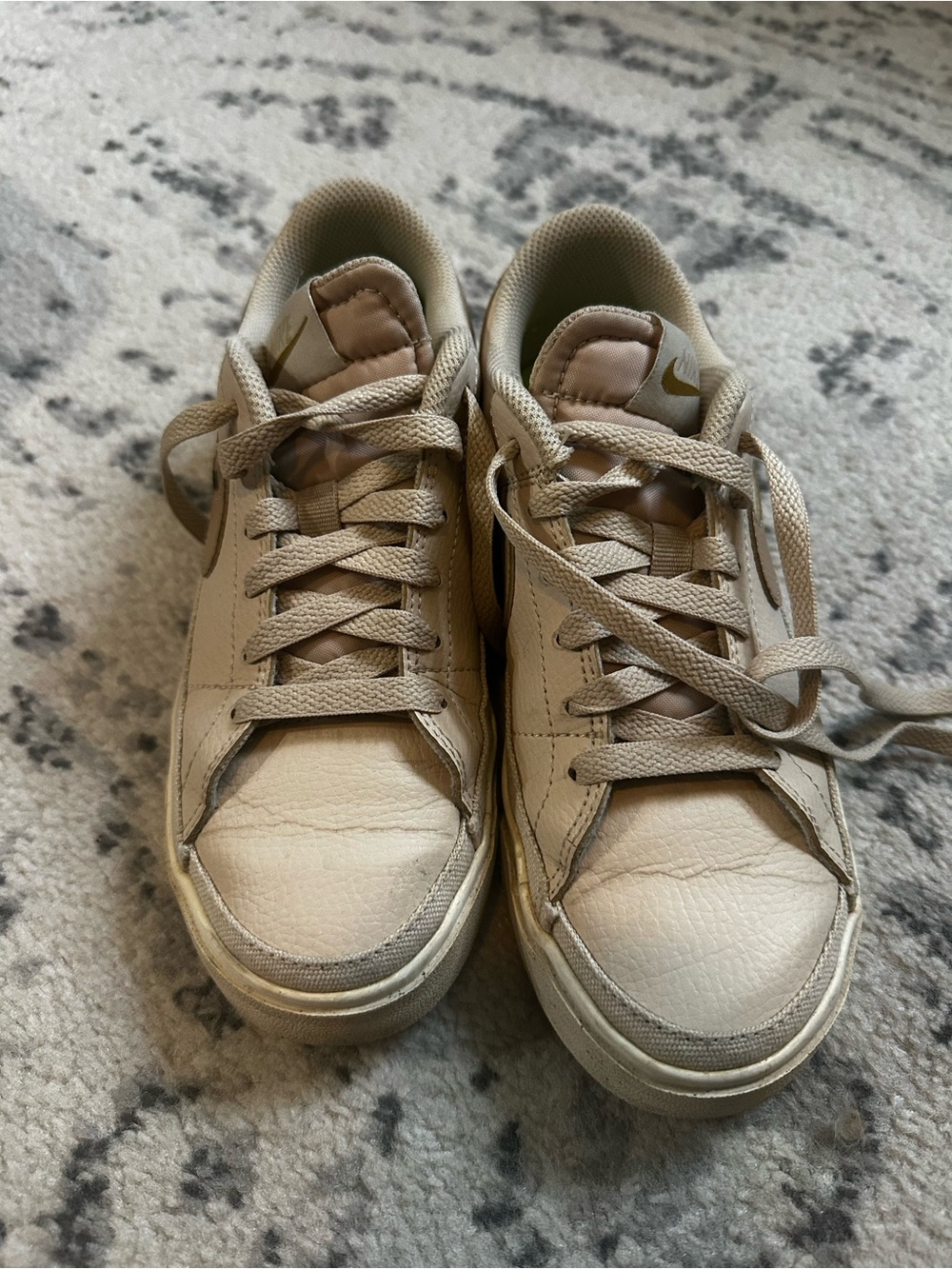 Nike women Tan Low-Top Sneakers with Gold Swoosh